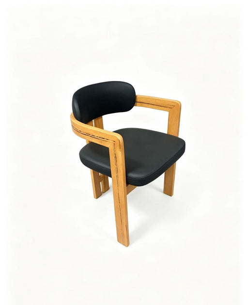 Prevelly PU Dining Chair in black PU with a timber frame, three quarter view