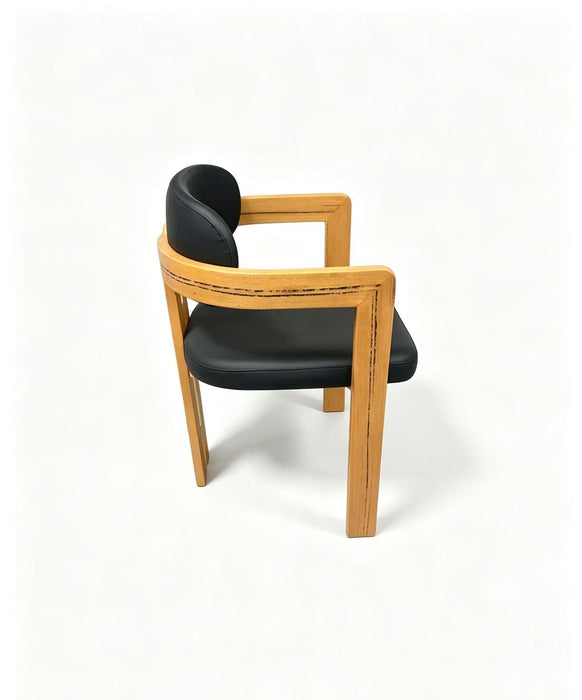 Prevelly PU Dining Chair in black PU with a timber frame, side view
