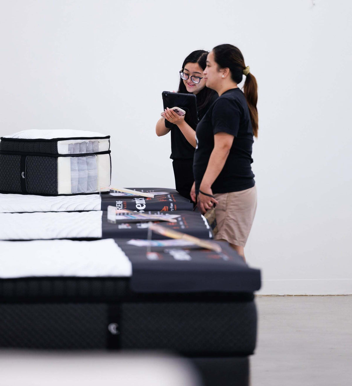 Furniture Bazaar team in store with the mattress range
